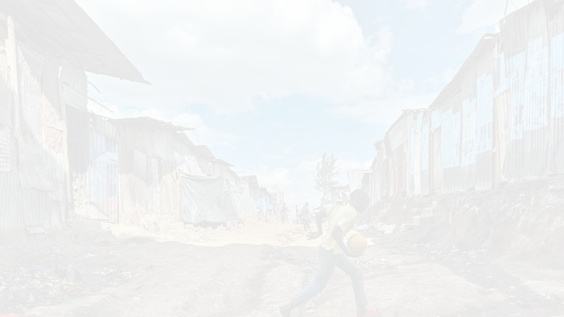 Young residents play along an access path between rows of shantees in one of Kenya's capital city, Nairobi's largest slums known as Mathare slum where a heavily polluted and unsanitary environment in addition to insecurity and extreme poverty have made it festering ground for disease and pandemics such as HIV/AIDS 