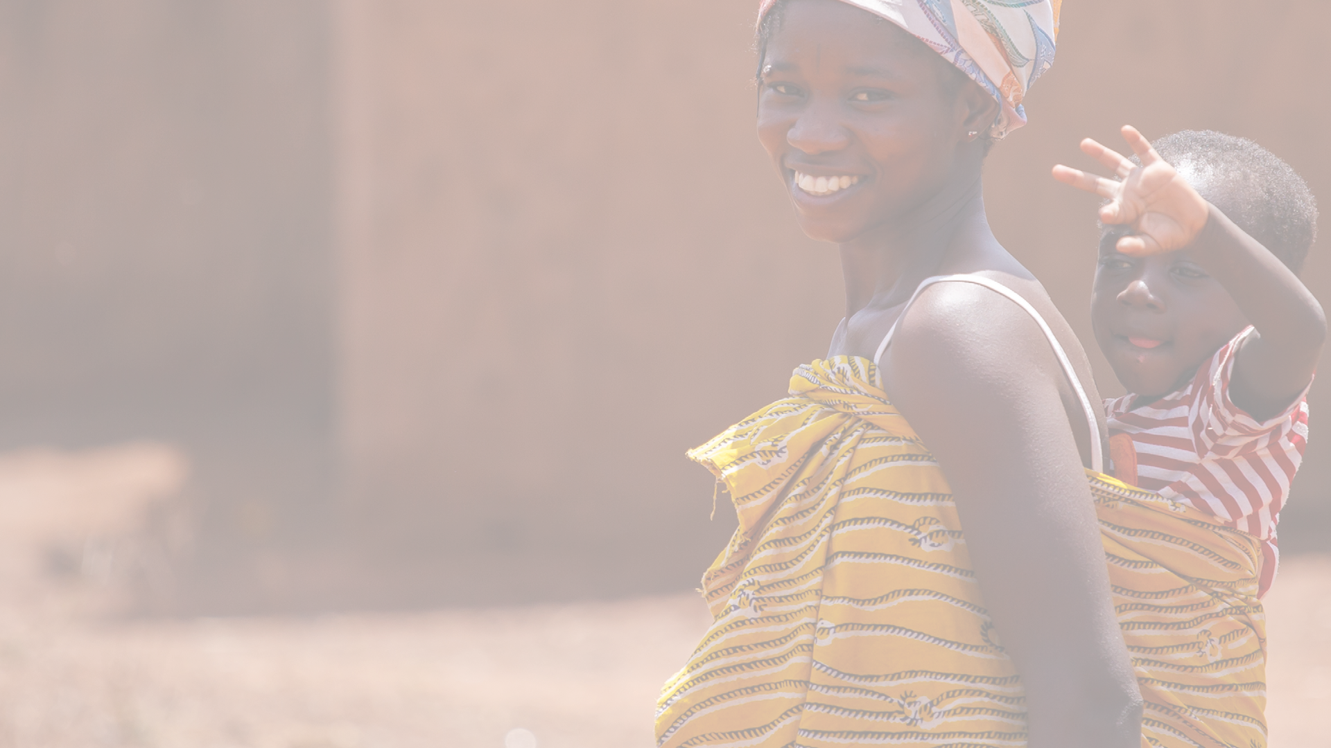 TAMALE, GHANA - MARCH 24: Unidentified African woman carrying her son on back on March 24, 2014 in Tamale, Ghana. Ghana is one of the most popular tourists destination in Africa.