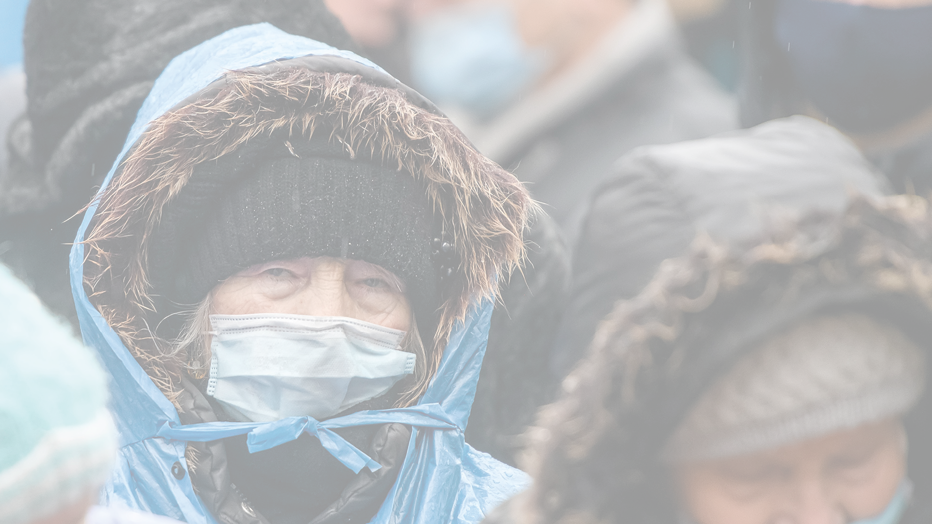 Elderly woman in a protective mask against coronavirus Covid 19 on the street in Kyiv, Ukraine. January 2021